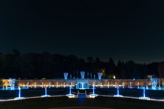 The Main Fountain Garden lit up with blue lights in each fountain. 